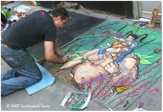 July 7--"Untitled"--Artist Mike Tanoory works on his sidewalk chalk painting for the Arts Festival in Columbus Circle.