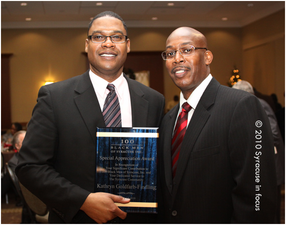 Mark Muhammad (left) accepting award for The Gifford Foundation's Kathy Goldfarb Findling with Chapter President Vincent Love