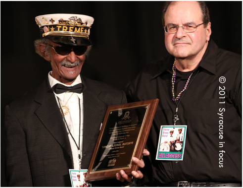 Syracuse JazzFest Founder and Impersario Frank Malfitano presents Uncle Lionel Batiste with a Jazz Legends Award at OCC on Friday.