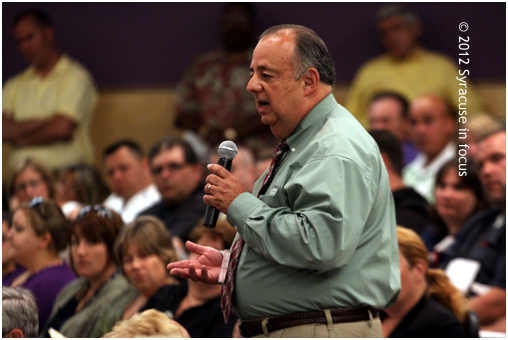 Otto Feliu addresses the panel and the crowd about chemical dependency treatment options.