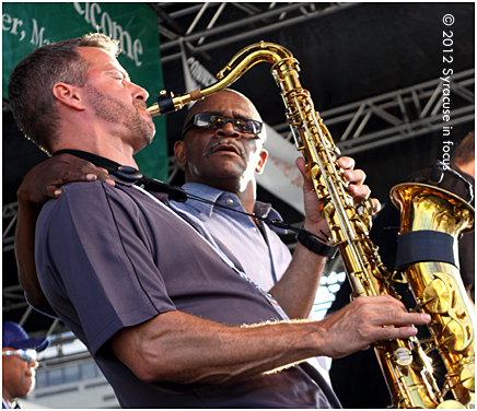 Eddie Wall Street gives some dap to horn player Dave Frateschi