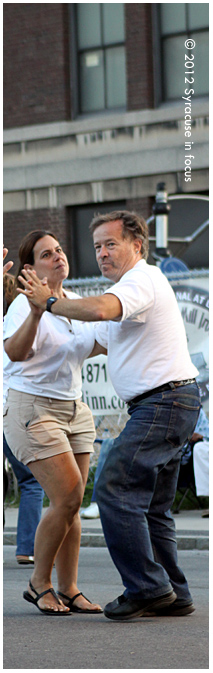 Publisher Hugo Acosta dances at Jazz in the City