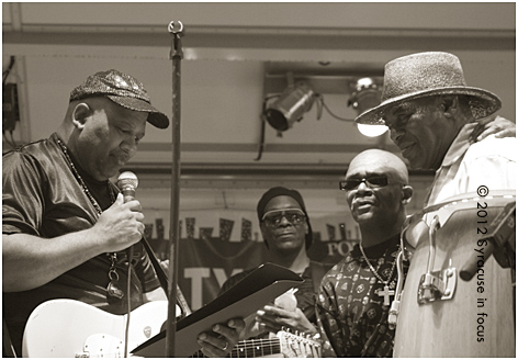 The Blacklites' Emanual Atkins reads a proclaimation from the band to Professor Rick Wright, the on-air personality from 620AM.