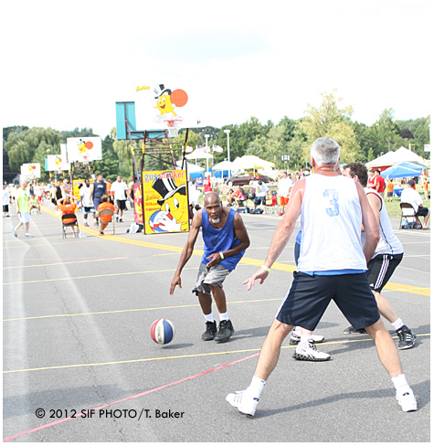 Julius "Pop" Anderson drives to the bucket during a 2nd round game at Gus Macker on Saturday.