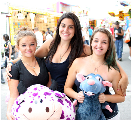 Lauren Wright, Mackenzie Rice and Autumn Rice of Liverpool display their prizes on the final day of the NYS Fair. They said it took them $15 dollars before they finally won.