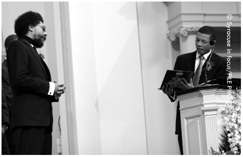 SU alum Travis Mason (right) giving an award to Dr. Cornel West during a AAMC event in 2005.