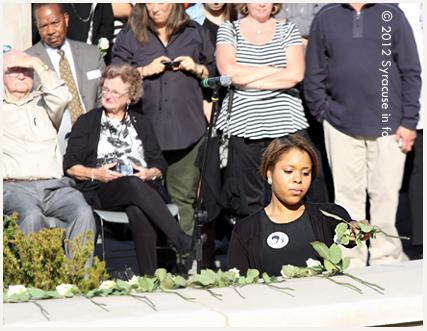 Laying a rose for Remembrance Week