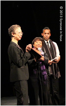 Karen Franklin and PRPAC Director Ryan Johnson-Travis present artist Cheryl Wilkins-Mitchell with an award at the end of the show.