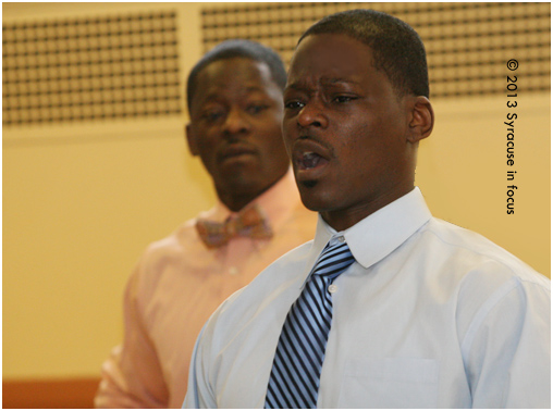 Drs. Sheadric Barbra, Principal of Dr. King Elementary School in Syracuse speaks during the Syracuse City School Distric and Say Yes to Education Parent University on Saturday morning. His brother, education activist Zheadric Barbra is in the background. The event was held at the University United Methodist Church.