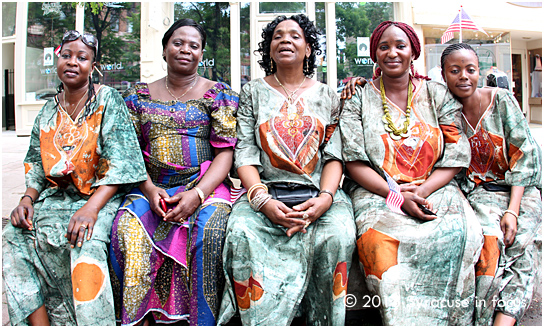 Ladies from the Central African Republic rest after their dance performance on stage in Hanover Square. The ladies came to Syracuse about one year ago