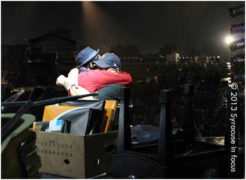 Napoleon Murphy Brock of the Grandmothers of Invention and Festival Producer Frank Malfitano hug it out during a lengthy rain delay.