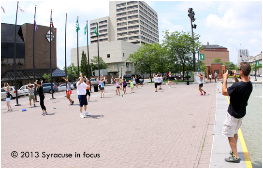 Randy Sabourin takes a video of the Wednesday class in Clinton Square.