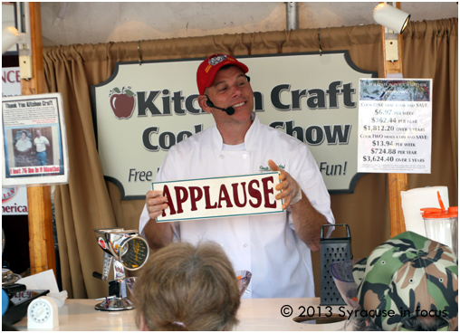 Chef Rick Muzzi reaches for a cue card after his cooking session.