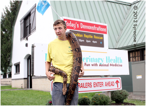 Shawn, a herpetologist in training, with Molly the Boa