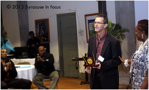 Syracuse Media Group columnist Sean Kirst was presented with the Saundra Smokes Humanitarian Award at the City Hall Commons Atrium tonight.