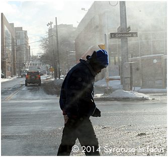 Leaning into a 20 m.p.h wind gust (East Genesee Street, walking west)