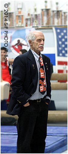 Gymnastics judge Abe Gabriel flexes his Suit & (SU) Tie Game