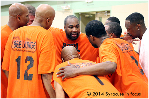 Dave Cain addresss the team during a second half time out.