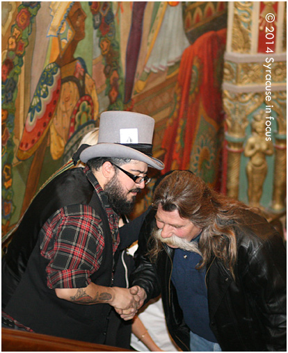 Judge Cayetano Valenzuela (left) greets Robert LaPam during the walkthru, but notice he also pulls him in close to inspect his mustache. LaPam was a winner in the "Fighter" category.