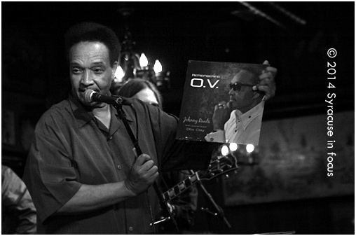 Happy National Record Store Day: Blues singer Johnny Rawls holds up his latest "album" during a performance at the Dinosaur Bar-B-Que.