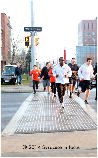 Syracuse Housing Authority Chief and SU grad Bill Simmons was one of the early finishers who ran with Chancellor Syverud