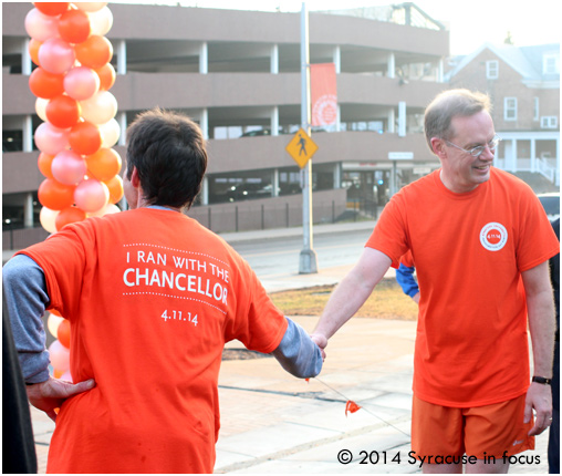 SU Chancellor Kent Syverud at the finish line of the run for fun Friday morning (a few hours before his inauguration)