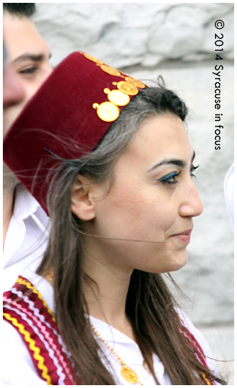 SU Professor Seval Kömürcü's sports a Fes-style hat at an event in downtown Syracuse