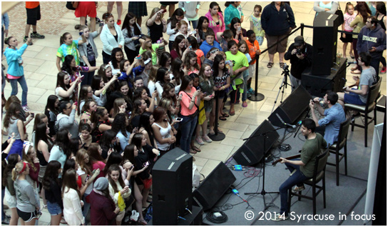 Meet me at the Mall: Fans jockey for position as the band AJR prepares for a show in Destiny USA's Canyon on Thursday evening.