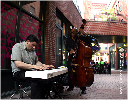 Syracuse Jazz Masters Dave Solazzo and Bill Horrace played a concert in the courtyard near Lemon Grass + Bistro Elefant on Friday night.