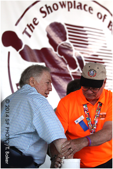 Photographer Neil Leifer got a fist cast with the assistance of International Boxing Hall of Fame Chairperson John Hunt on Friday.