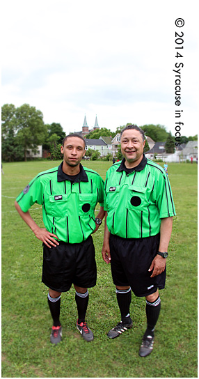 Former SU Soccer player Charles Schoenig and his father Ken share a love for soccer. The two men refereed the soccer tournament for World Refugee Day at Schiller Park yesterday.