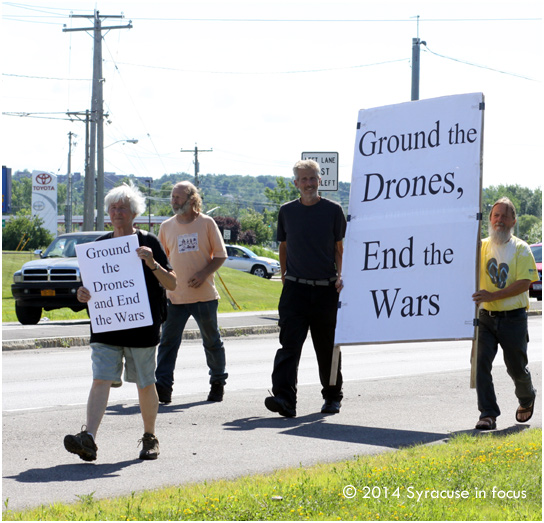 Peaceful protesters from the Syracuse Peace Coucil and others from as far away as Ithaca and Connecticut marched in East Syracuse along Kinne Road.