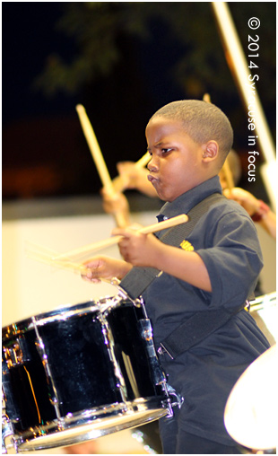 Young drummer Maxwell Brown leads the Syracuse Elks Band in closing out the 12th Annual Mothers Against Gun Violence Vigil on Sunday. His father is drummer Nate Brown from Brownskin Band.