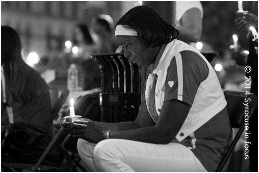 Common Councilor Helen Hudson takes a moment to reflect at the Mothers Against Gun Violence 12th Annual Candlelight Vigil Sunday evening in Clinton Square.