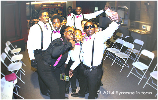 Members of the Elks Pride 315 drumline take a photo during their pre-performance walk-thru at Syracuse Fashion Weekend last night.