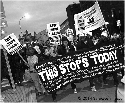 The march swelled as it reached the Connective Corridor (University Avenue).