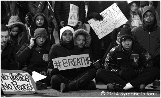 The marchers staged a sit-in on State Street, in front of the courthouse and justice center, brining downtown traffic to a standstill.