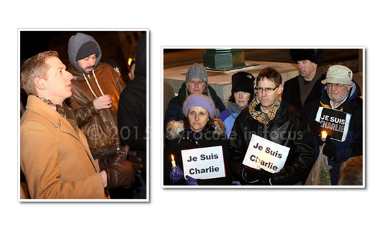 Syracuse Press Club officer Josh Cradduck speaks during a vigil for slain French journalists held in Clinton Square on Saturday night.