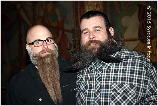 Todd Yoder (right), a two-time beard champ, said he hasn't shaved his tentacled facial sweater since last year. He is pictured here with a fellow winner.