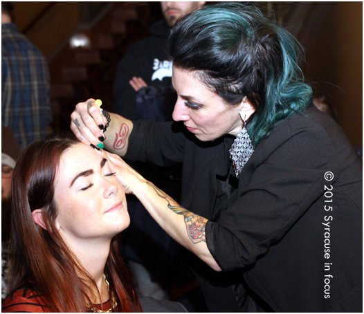 Shannon Fleming (right) preps a contestant at the Festival of the Fantastical Facial Follicle.