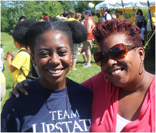 Student intern Abiba Salahou and Vision Center Program Director Gina Rivers enjoy the festivities before the duck race.