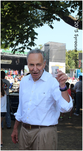 Sen. Charles Schumer chugged some milk and made a brief pitstop in Chevy Court on his way to see his face on the sand sculpture in the Center of Progress Building.