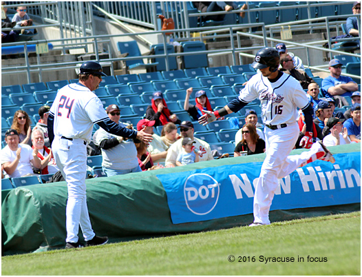 Skipper approved: Billy Gardner congratulates Skole as he rounds third base.