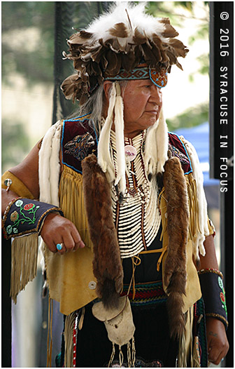 Elder watching dance competition.