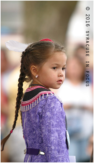 Young child awaiting smoke dance competition, Hanover Square