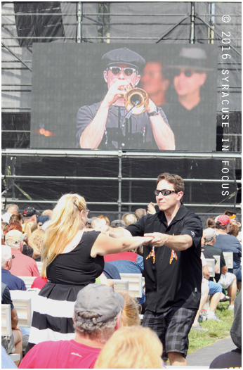 A couple dances to the fiesty jazz sounds of Big Bad Voodoo Daddy on the opening day of the New York State Fair.