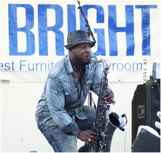 Elan Trotman made a return to Syracuse yesterday for the Jazz in the City Series. He shared the stage with keyboardist Brian Simpson, as well as Rochester musicians Corey Owes and Carlton Wilcox. The show shut down a portion of Park Avenue and overflowed the parking lot of Strada Mia 313.