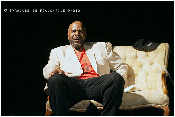 Writer, actor, teacher, entrepreneur Omanii Abdullah on stage at the Community Folk Art Center (circa 2012)