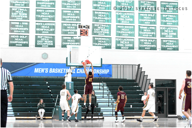 Reyes hammered home a dunk in the first half of yesterday's game.