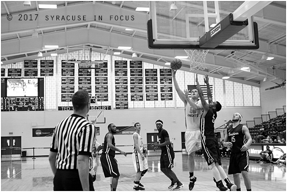 Junior forward Jack Jones sweeps up a sky hook during Sunday's game against Southern Connecticut. The College of St. Rose won the game 67-47,